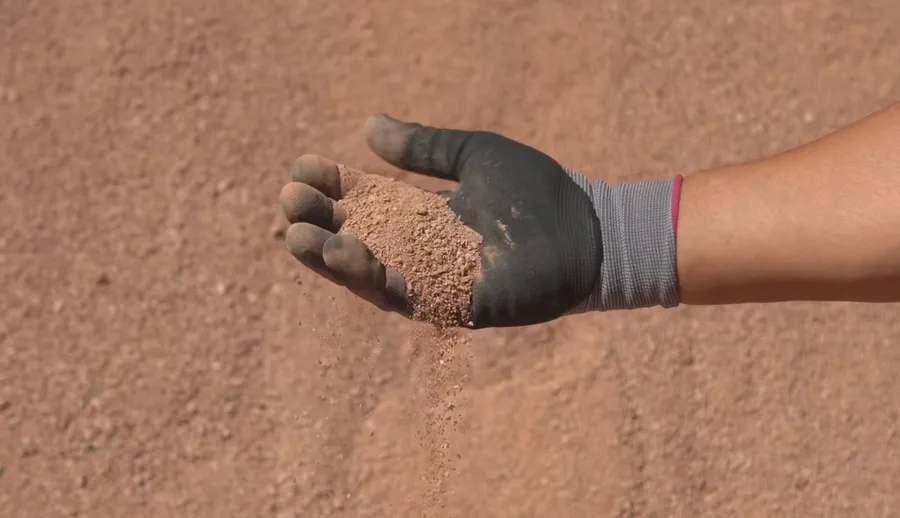 vegas gold decomposed granite crusher fines texture in gloved hand