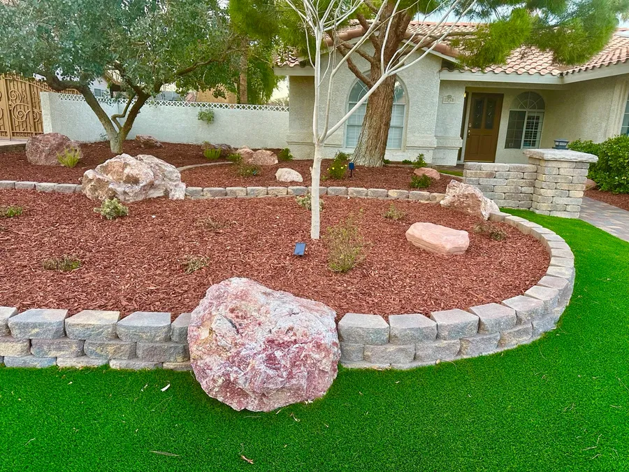 red rock landscaping with red decorative boulders in las vegas yard