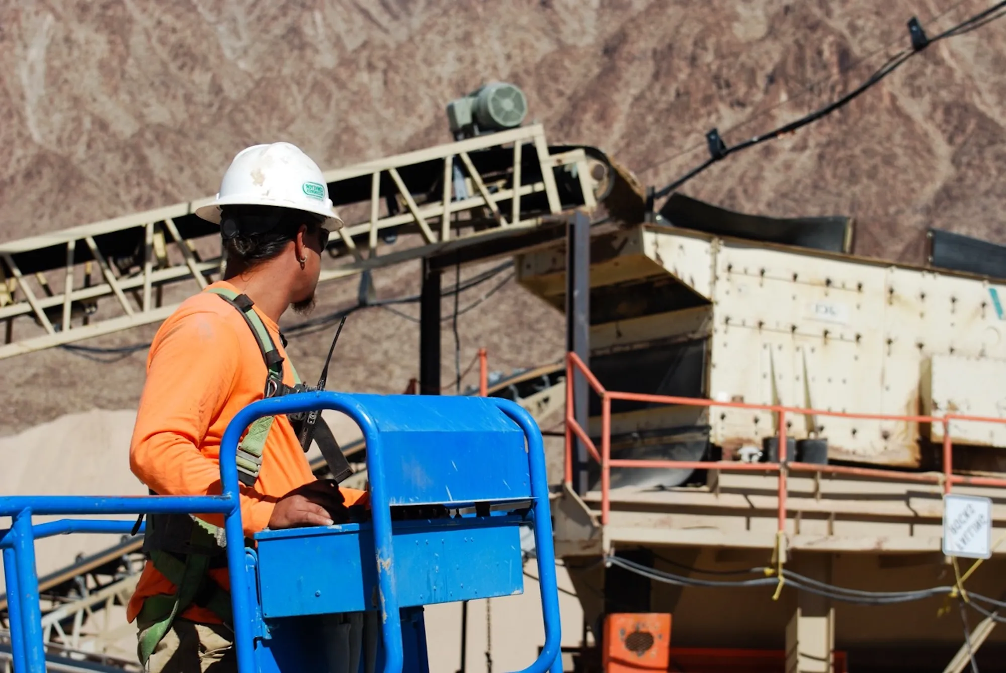 impact sand and gravel quarry worker operating equipment at a las vegas pit during a shift